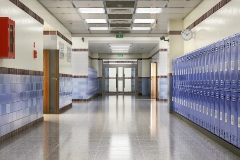 Long school corridor with blue lockers , 3d illustration